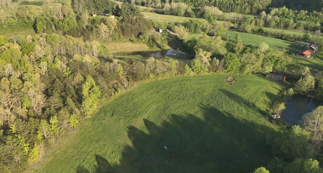 aerial view with a rural view and a water view