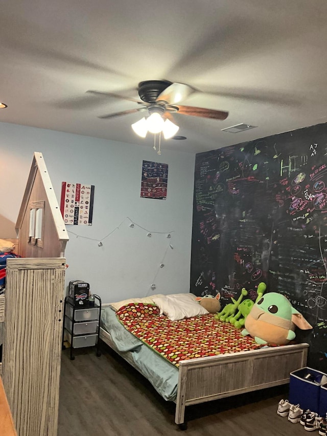 bedroom featuring ceiling fan and hardwood / wood-style floors