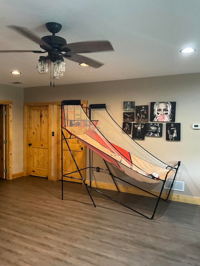 game room with ceiling fan and wood-type flooring