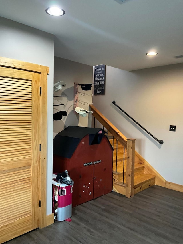 stairway featuring dark hardwood / wood-style flooring