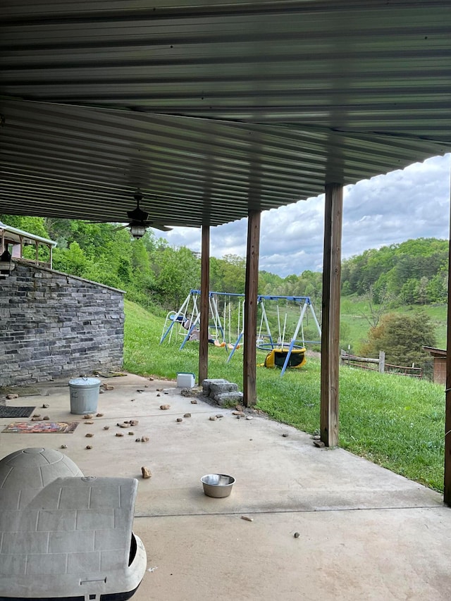 view of patio featuring a playground