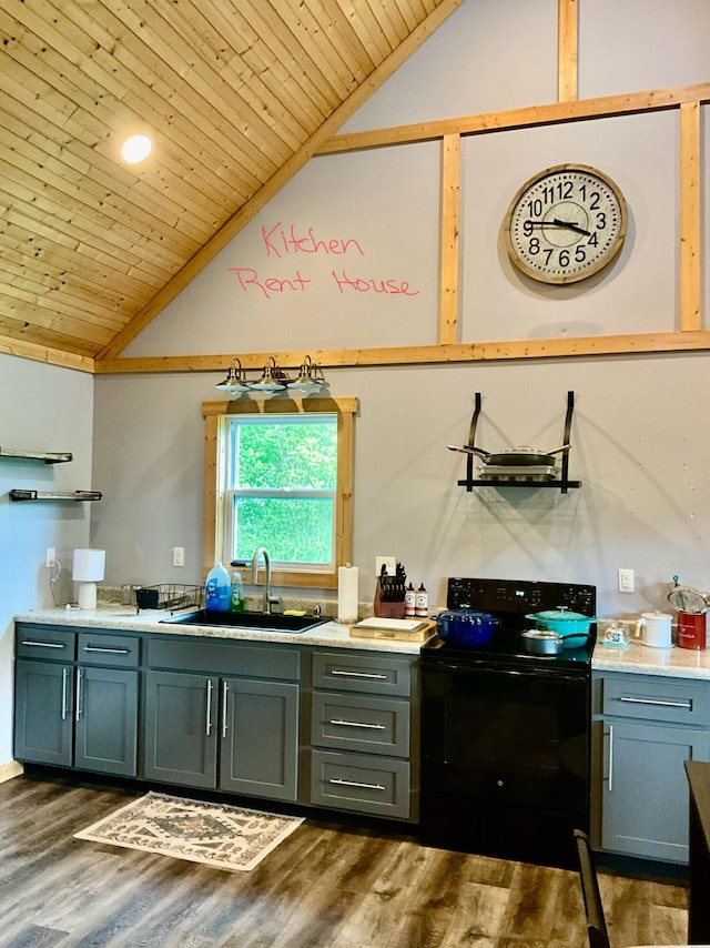 kitchen with sink, black range with electric stovetop, wood-type flooring, and vaulted ceiling