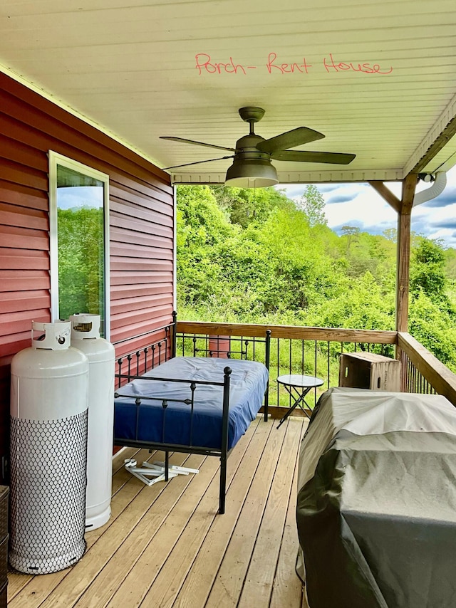 wooden terrace with ceiling fan