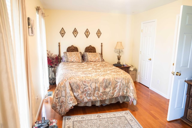 bedroom with hardwood / wood-style flooring