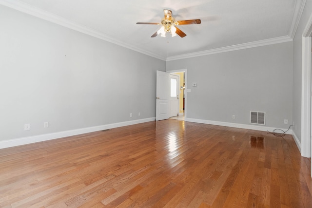 spare room with light hardwood / wood-style floors, ornamental molding, and ceiling fan