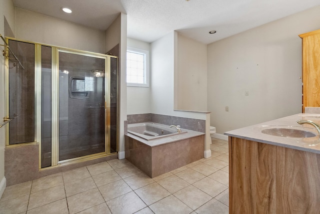 full bathroom with toilet, tile patterned flooring, vanity, shower with separate bathtub, and a textured ceiling