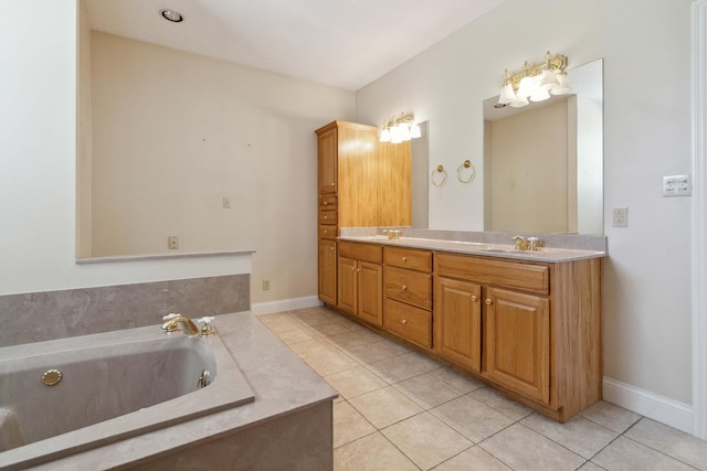 bathroom featuring vanity, tile patterned floors, and a bathtub