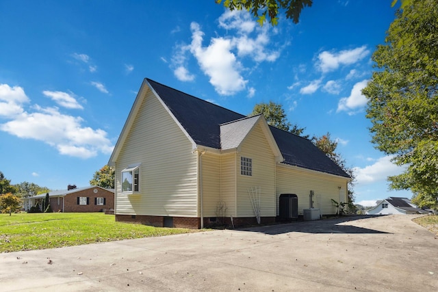 view of property exterior with a yard