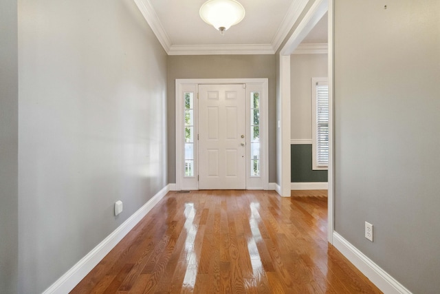 foyer featuring crown molding and wood-type flooring