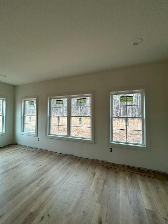 unfurnished room featuring light wood-type flooring