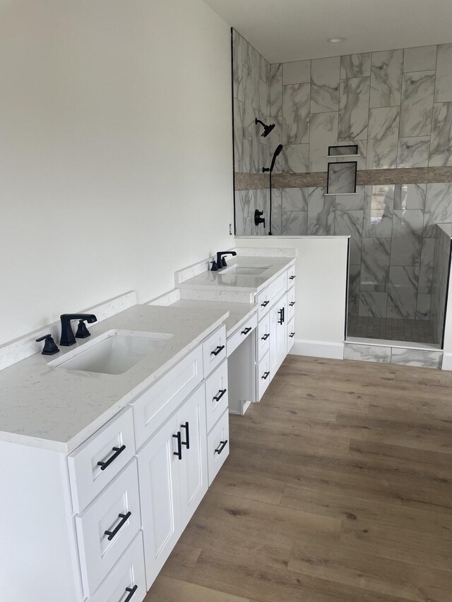 bathroom featuring hardwood / wood-style flooring and sink