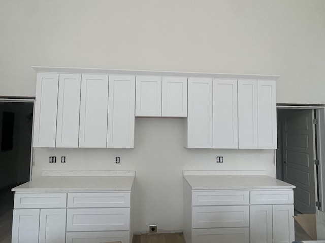 kitchen with light countertops and white cabinets