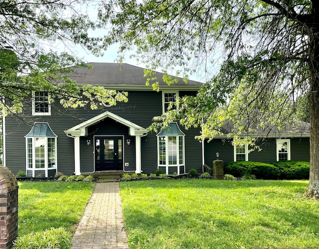 view of front of property with a front lawn