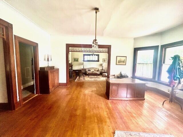 unfurnished dining area featuring wood-type flooring