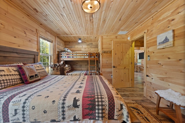 bedroom featuring hardwood / wood-style floors and wooden ceiling