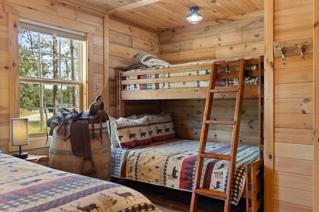 bedroom with hardwood / wood-style flooring and wood ceiling