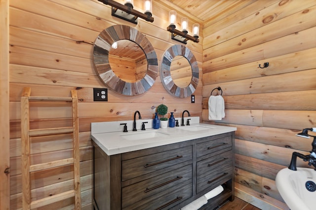 bathroom with a bath to relax in, double sink vanity, and wooden ceiling