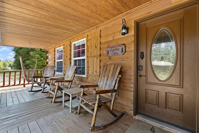 property entrance featuring a porch