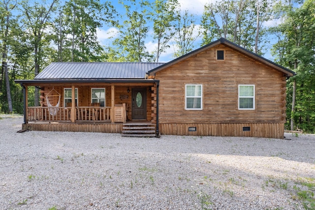 log-style house with a porch