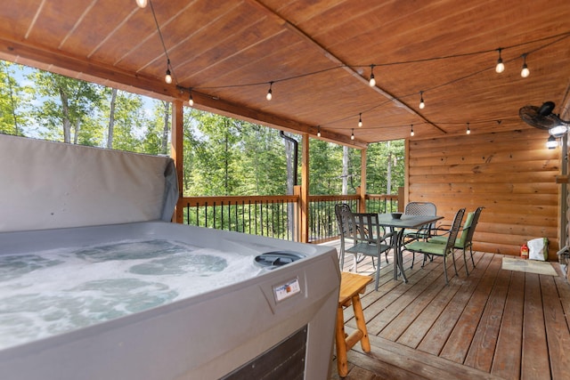 wooden terrace with a hot tub