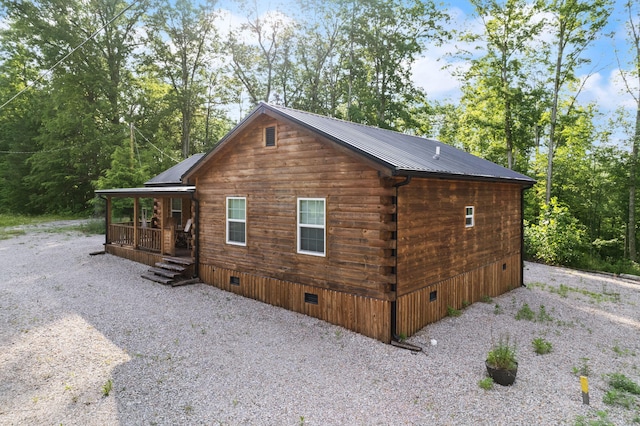 view of side of home featuring a porch