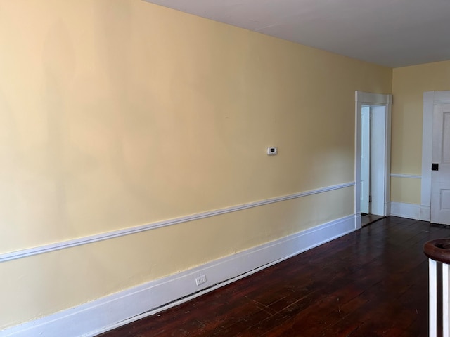 spare room with hardwood / wood-style floors