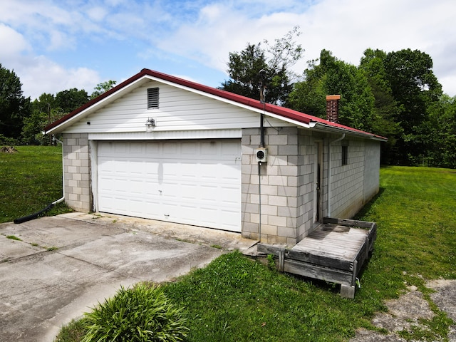 garage with a lawn