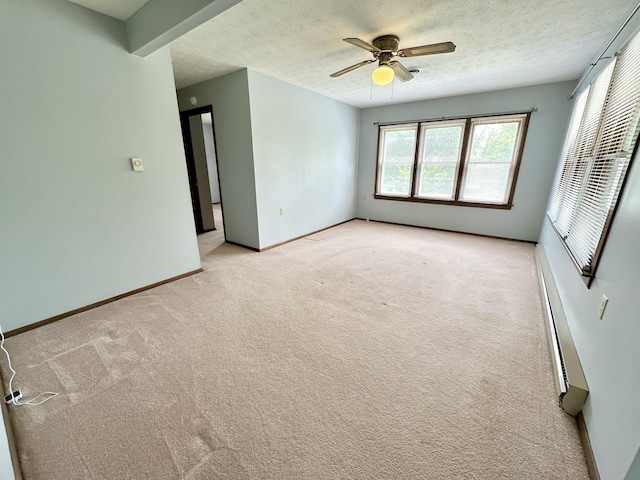 spare room featuring a textured ceiling, beam ceiling, ceiling fan, and carpet flooring