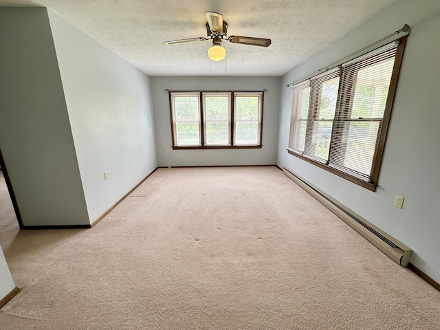 unfurnished room featuring a baseboard radiator, ceiling fan, light carpet, and a textured ceiling