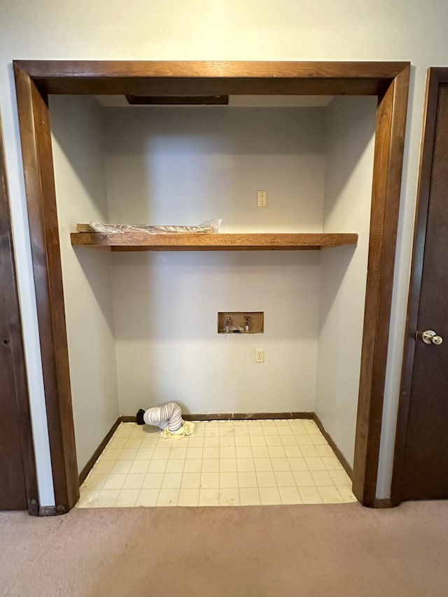 clothes washing area featuring carpet and washer hookup