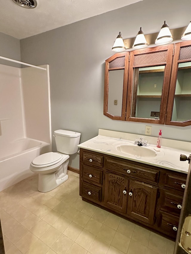 full bathroom featuring toilet, tile floors, vanity, and shower / tub combination