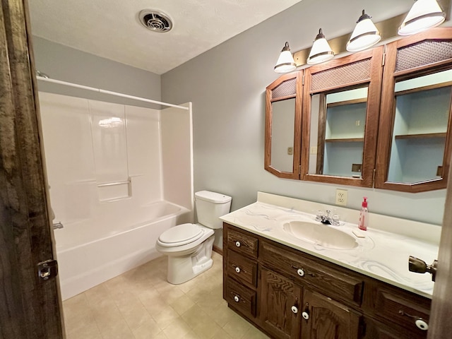 full bathroom with shower / washtub combination, toilet, tile flooring, and vanity with extensive cabinet space