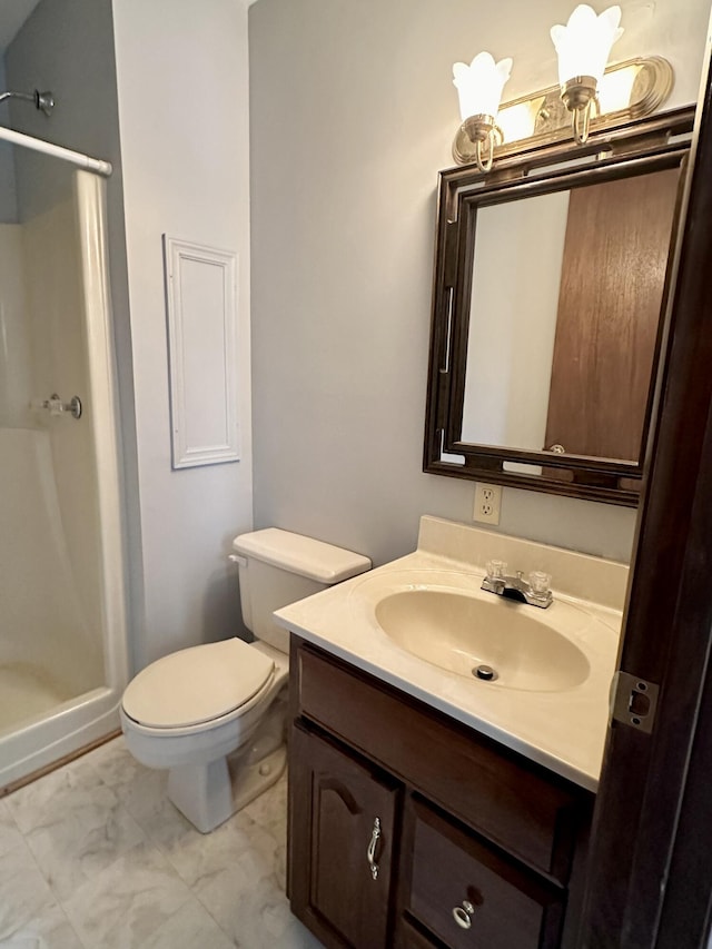 bathroom featuring a shower with shower door, toilet, tile flooring, and vanity