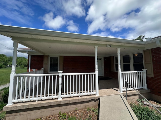 entrance to property with a porch