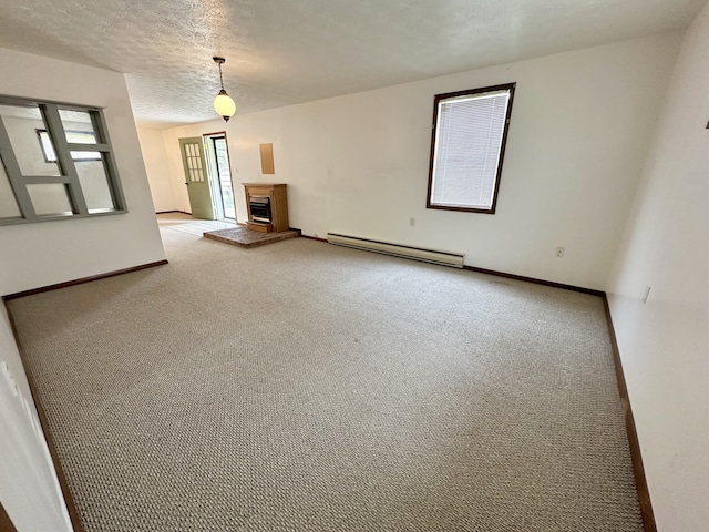 unfurnished living room with a baseboard radiator, carpet floors, and a textured ceiling