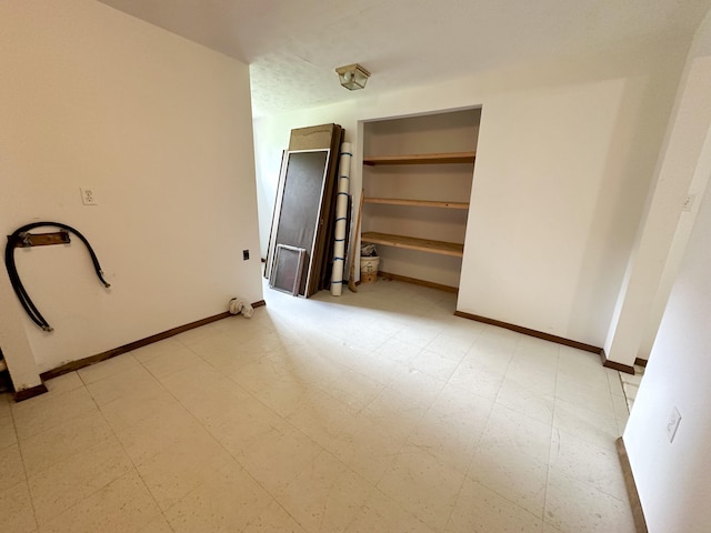 unfurnished bedroom with light tile flooring