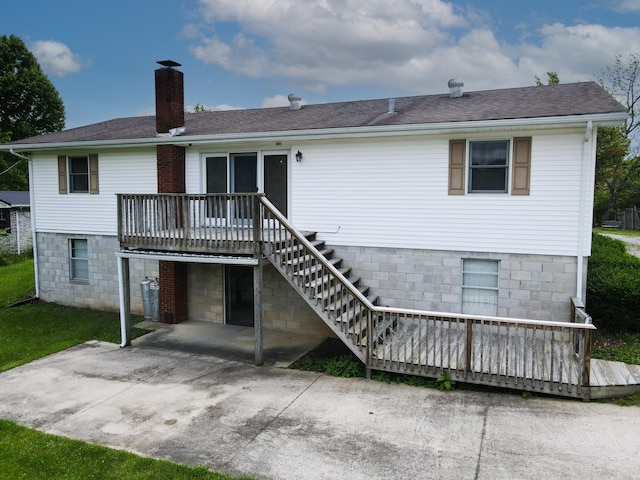 back of property with a patio