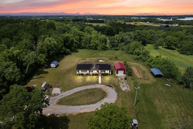 aerial view at dusk featuring a rural view