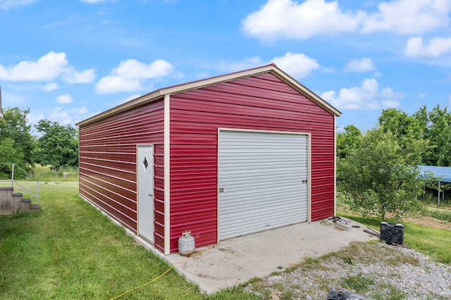 garage with a yard