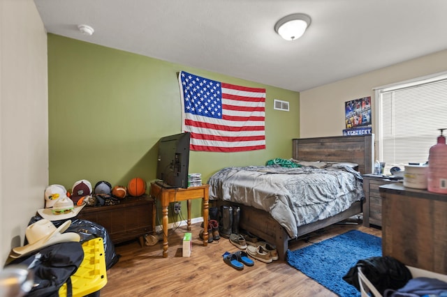 bedroom with wood-type flooring