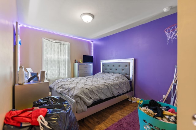 bedroom with hardwood / wood-style floors