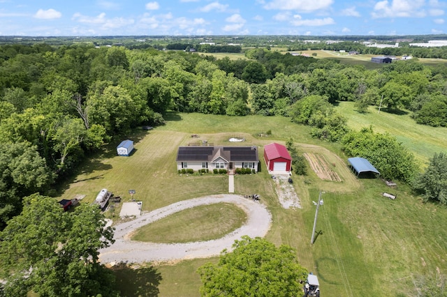 birds eye view of property with a rural view