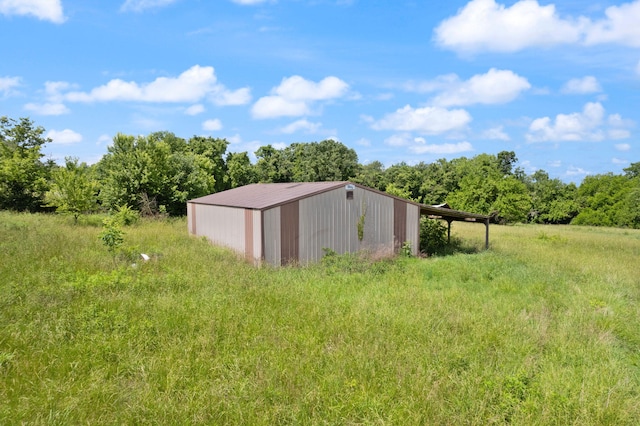 view of outbuilding featuring a rural view