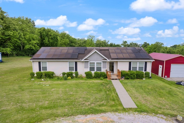 ranch-style home featuring a garage, solar panels, and a front lawn