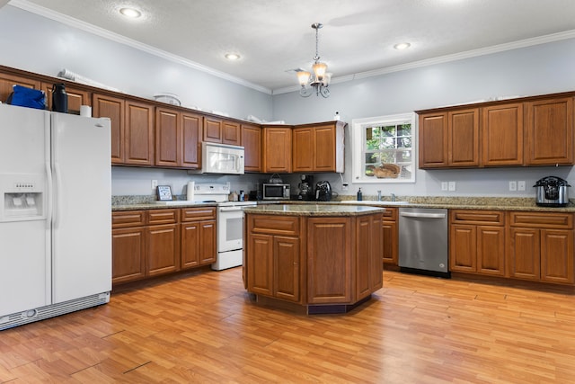 kitchen with light hardwood / wood-style floors, a kitchen island, an inviting chandelier, stainless steel appliances, and pendant lighting