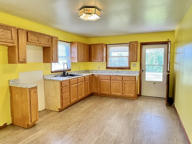 kitchen featuring sink and light wood-type flooring