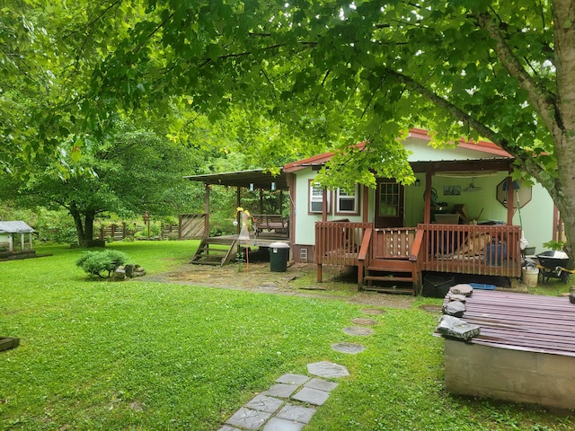 view of yard featuring a deck