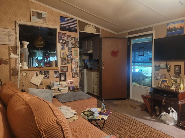 carpeted living room with crown molding and lofted ceiling