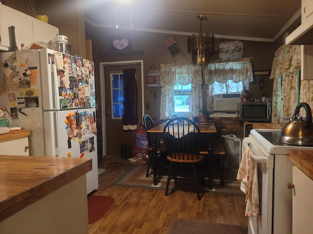 dining room featuring wood-type flooring and ornamental molding