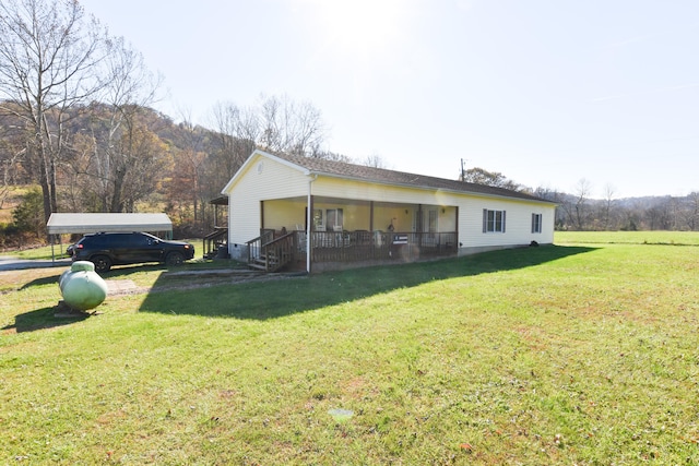 exterior space featuring a lawn and a porch